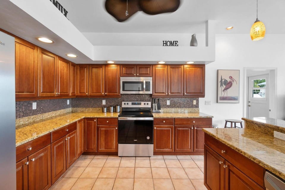 The fully equipped kitchen is stocked and ready for any cooking endeavor.