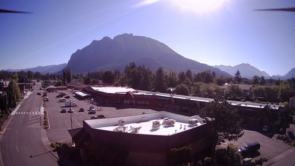 Shopping Center across the street from Moon River Suites with Mt Si in background