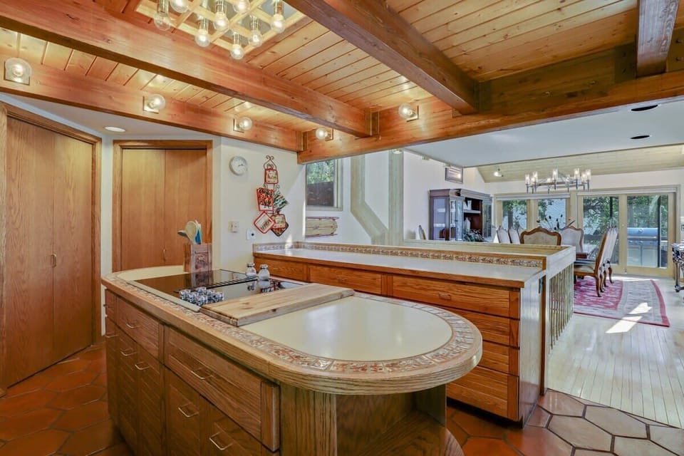 Fully stocked kitchen sharing a floor with the dining room