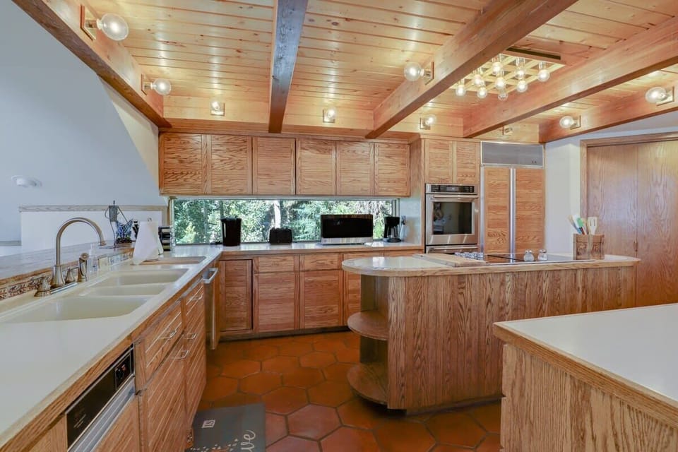 Fully stocked kitchen sharing a floor with the dining room