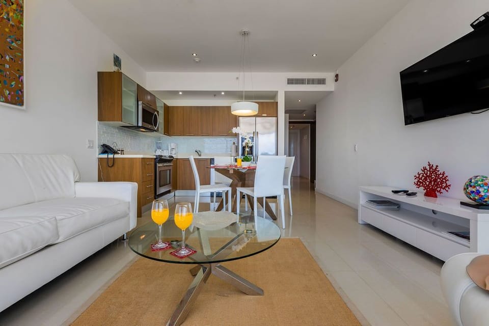 Step into this bright, open living space where modern elegance meets comfort. Your fully equipped kitchen flows into a cozy dining and lounge area, perfect for unwinding after exploring.