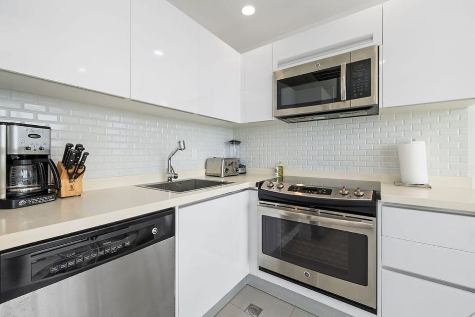Your sleek, modern kitchen comes fully equipped with stainless-steel appliances, perfect for preparing meals in style and comfort.