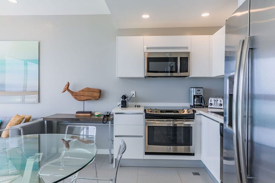 Your stylish kitchen awaits with modern stainless steel appliances, sleek cabinetry, and everything you need to whip up your favorite meals—coffee maker, microwave, oven, and more.