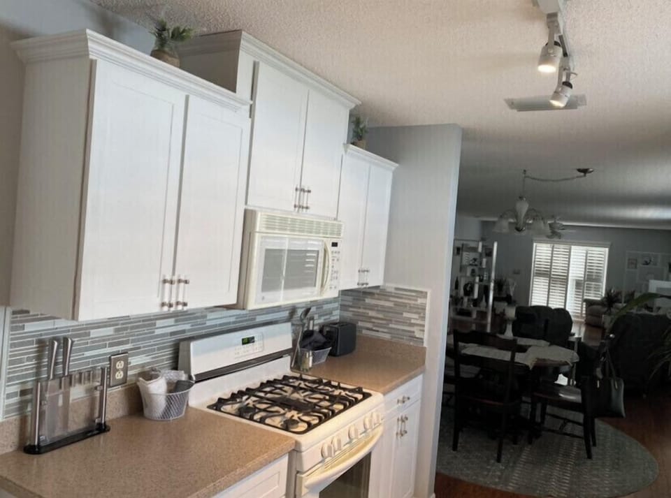 Gas stove and fully stocked kitchen for all your cooling/baking needs.