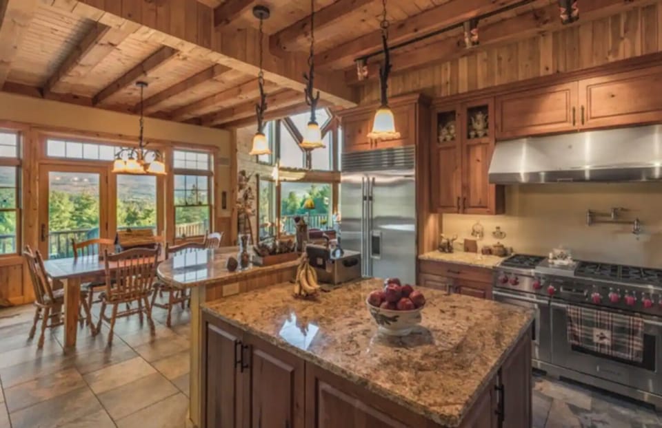 Kitchen and dining areas.  Chef's dream Wolf Range & Sub Zero Fridge