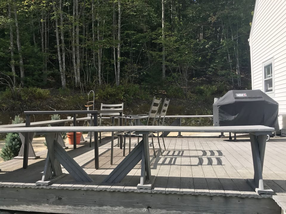 The deck has a table, chairs for 8 and a grill