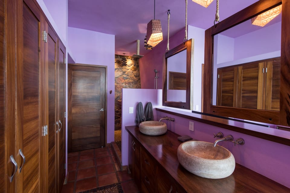 Purple Bedroom - rock wall behind shower
