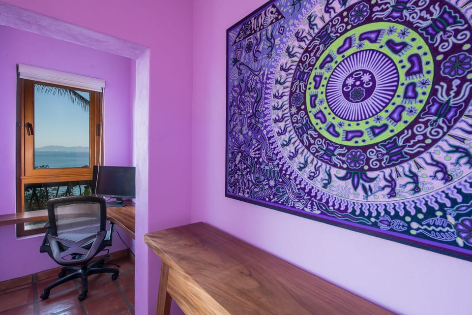Purple bedroom - work area with ocean view