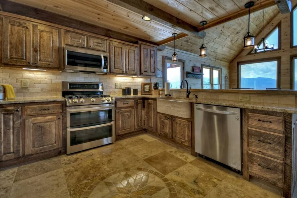 Fully equipped kitchen with stainless steel appliances and granite countertops