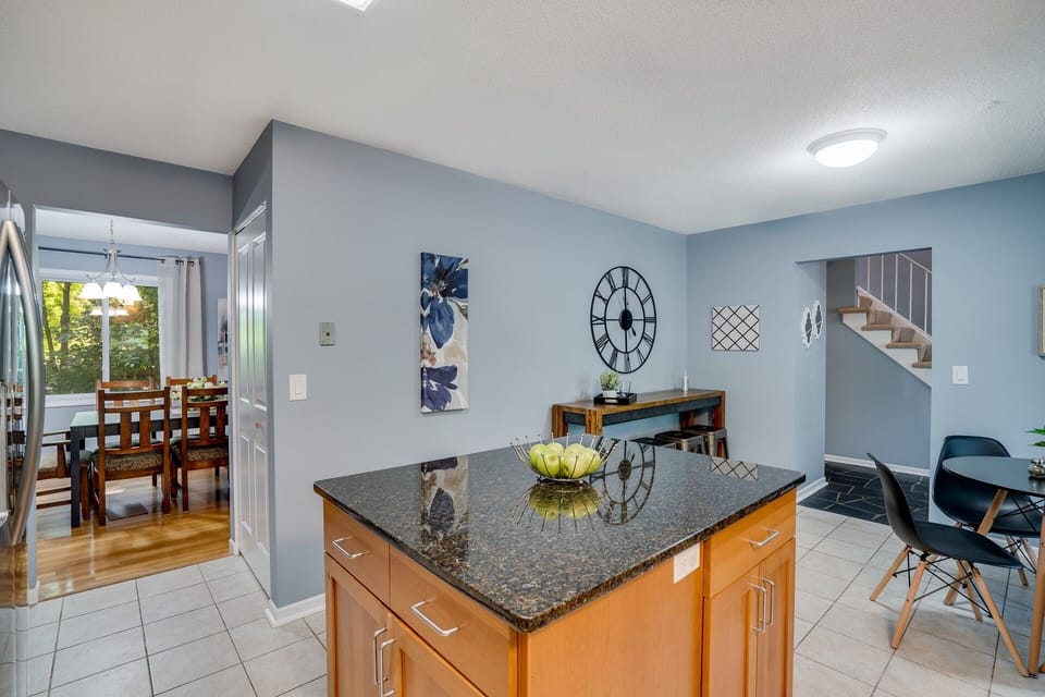 Large island and additional kitchen seating. 