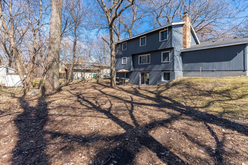 Back of the home with beautiful views of nature. 