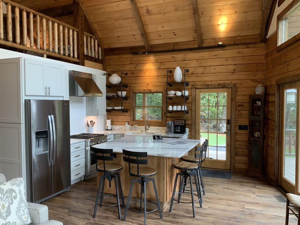 GE Profile gas range and large kitchen island