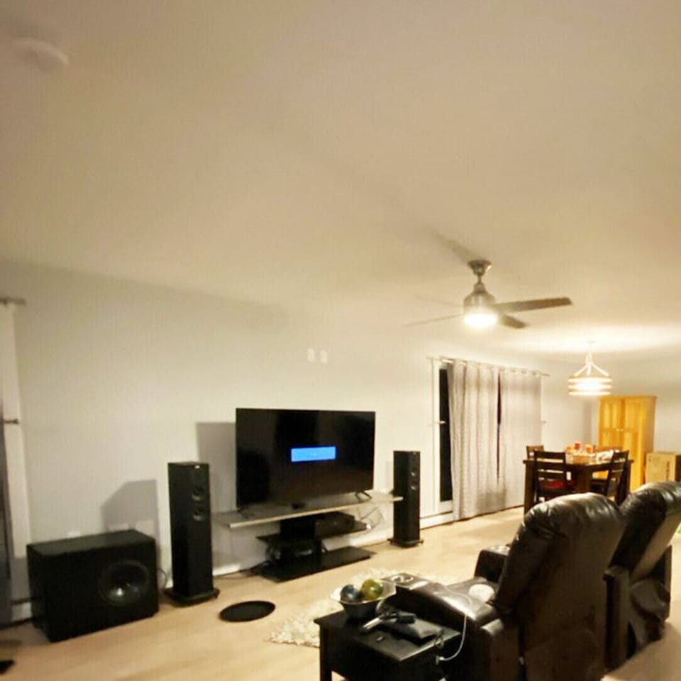Two Movie Theatre Leather Recliners with Large 60" TV