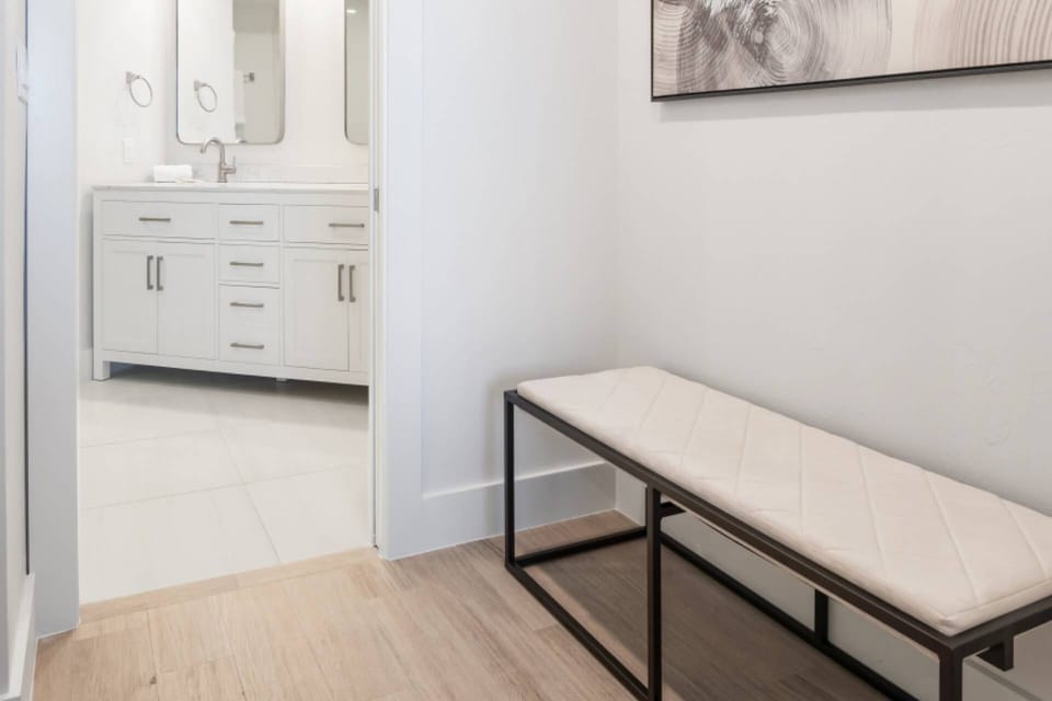 This breezeway from the primary bedroom to the bath is slated to become a custom California Closets built-in dresser and vanity area in early 2022.