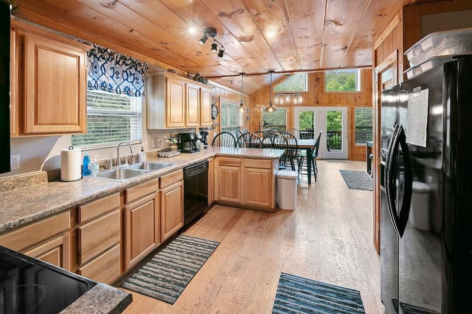 Meal prep`s not left out in the equipped kitchen opening to the great room.