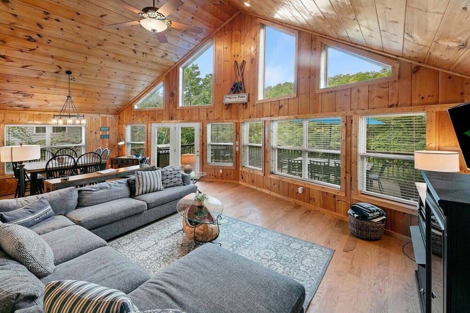 Open great room`s soaring knotty-pine ceilings invite you to come unwind here!