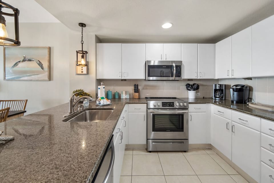 Your fully equipped kitchen awaits with granite counters, stainless appliances, and everything needed for memorable meals during your stay.