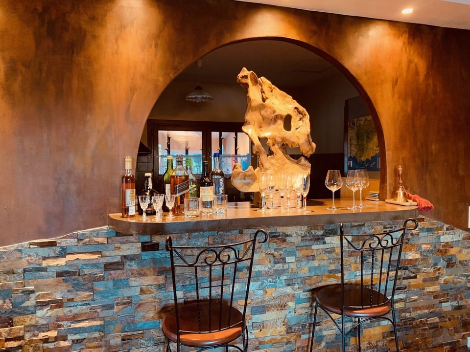 Bar stools to visit with the cook and pick up nibbles and a glass of wine