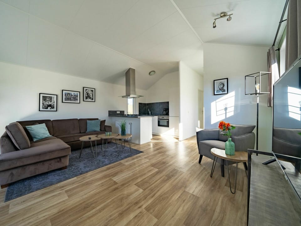Living Room, Room, Interior Design, Property, Wood Flooring, Floor, Furniture, Laminate Flooring, Building, Hardwood