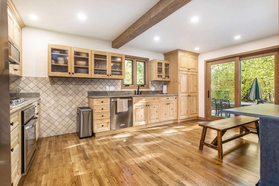 Spacious fully equipped kitchen with stainless steel appliances.