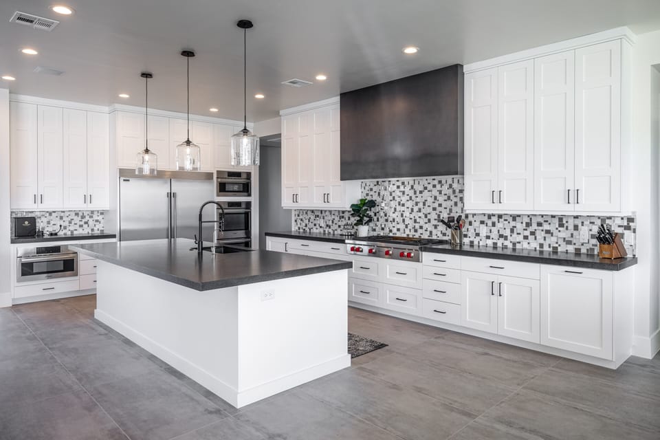 Kitchen - The kitchen is fully stocked with all the dishes, cookware, baking pans, and cutlery you will need for meal preparations and includes stainless steel appliances and granite counter tops.