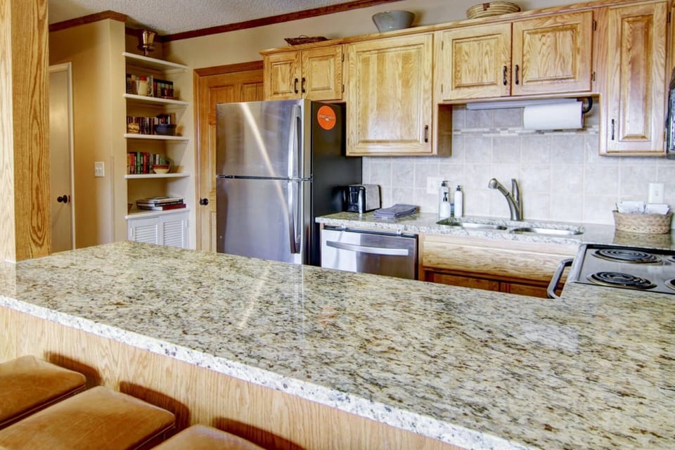 Warm and welcoming kitchen with all the essentials—just like home, but with a mountain view.