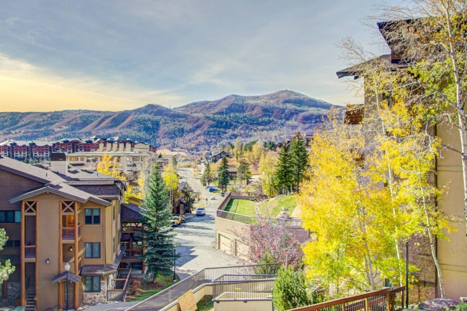 This sun-kissed mountain escape offers stunning views and a peaceful setting just outside the building.