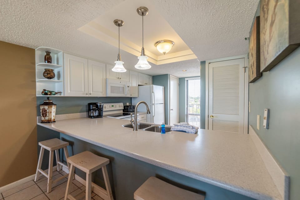 Sit at the bar and talk to the chef!  There is a stack washer and dryer in the closet by the window.