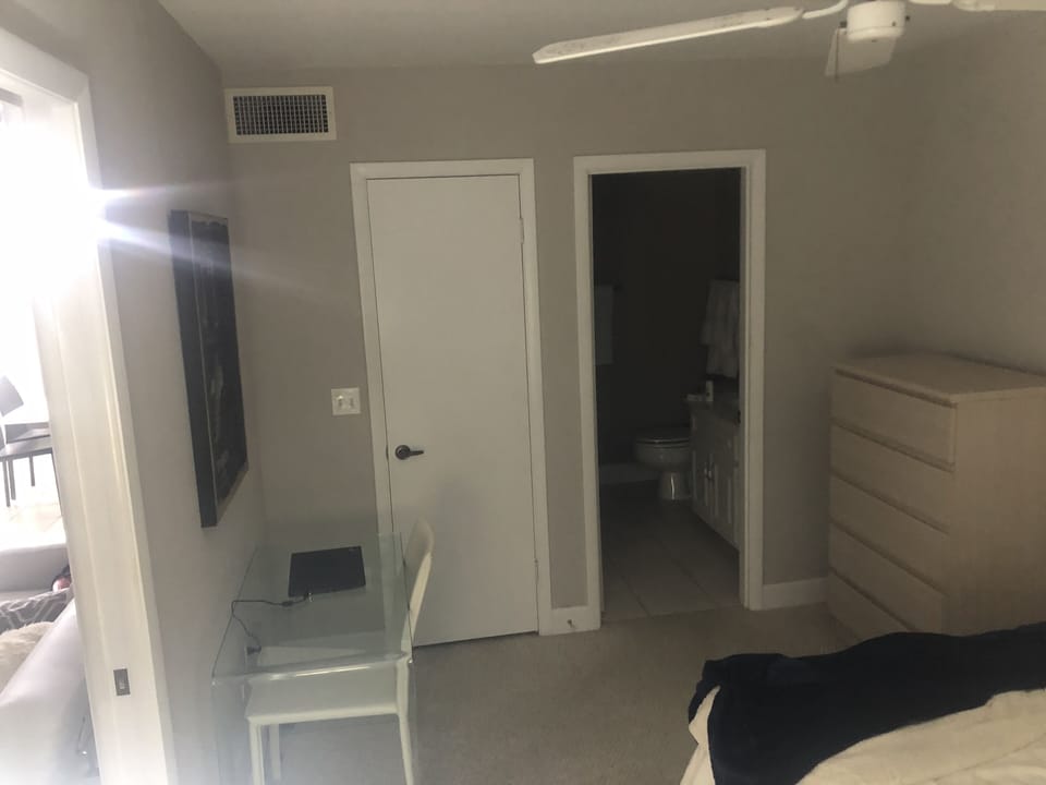 Guest bedroom. Glass desk with monitor and printer. Has own full bath.