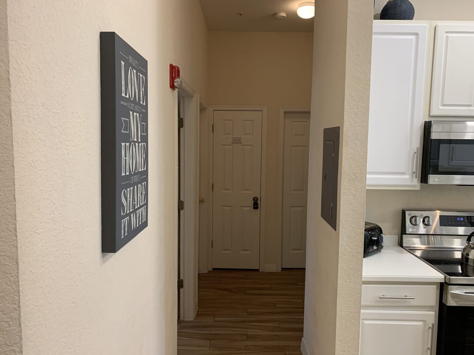 Hallway to Bedroom 2,3, Full Bath, Kitchen, & Laundry