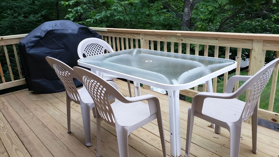 Private deck has shade provided by large beech tree. 