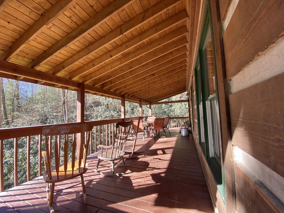 Huge covered patio with a charcoal grill! 