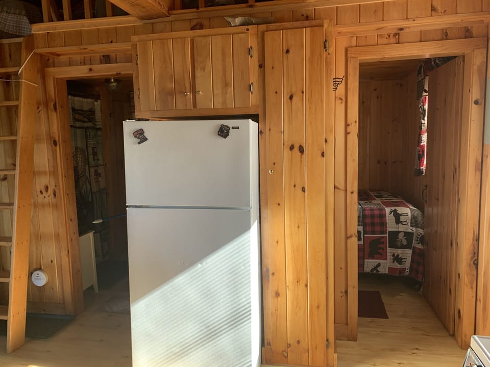 From the kitchen looking at door to the bathroom (left) and bedroom #1 (right)  