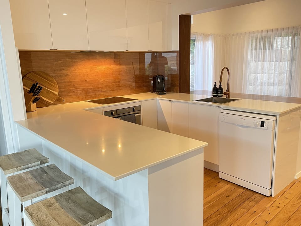 Open plan kitchen with seating on both front and rear peninsulas