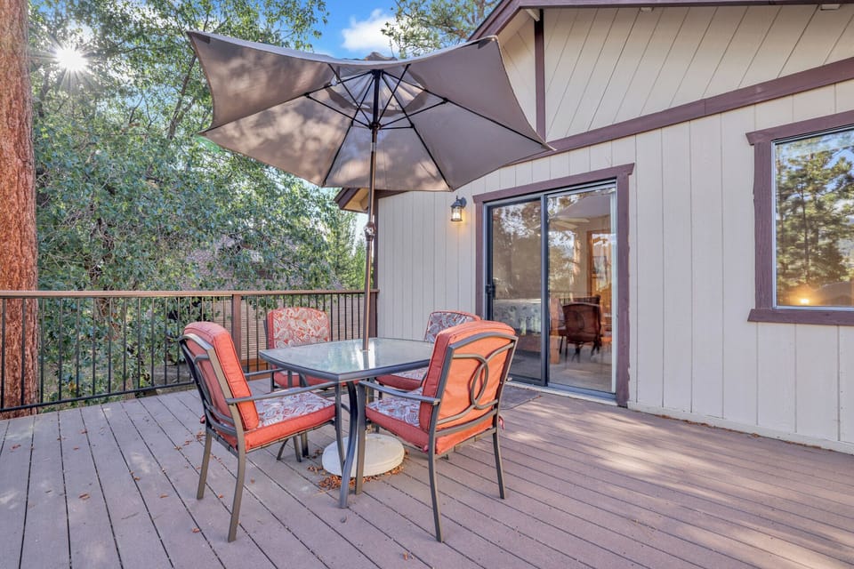 Private outdoor BBQ  surrounded by tall pines, perfect for relaxing under the trees after a day of adventure—enjoy peaceful forest views, fresh air, and a truly rejuvenating stay.