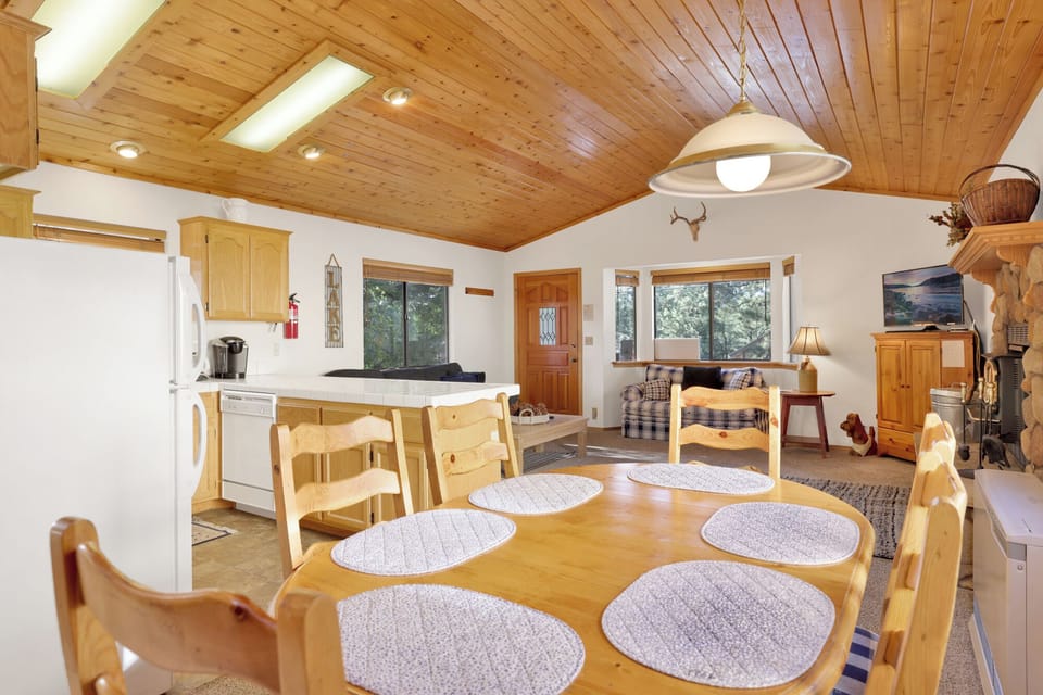 Fully equipped cabin kitchen with ample cabinetry, stove, fridge, microwave, and coffee maker—perfect for cooking meals, morning coffee, and feeling right at home on your stay.