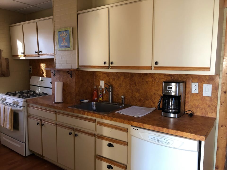 Retro galley kitchen fully stocked for cooking eating entertaining 
