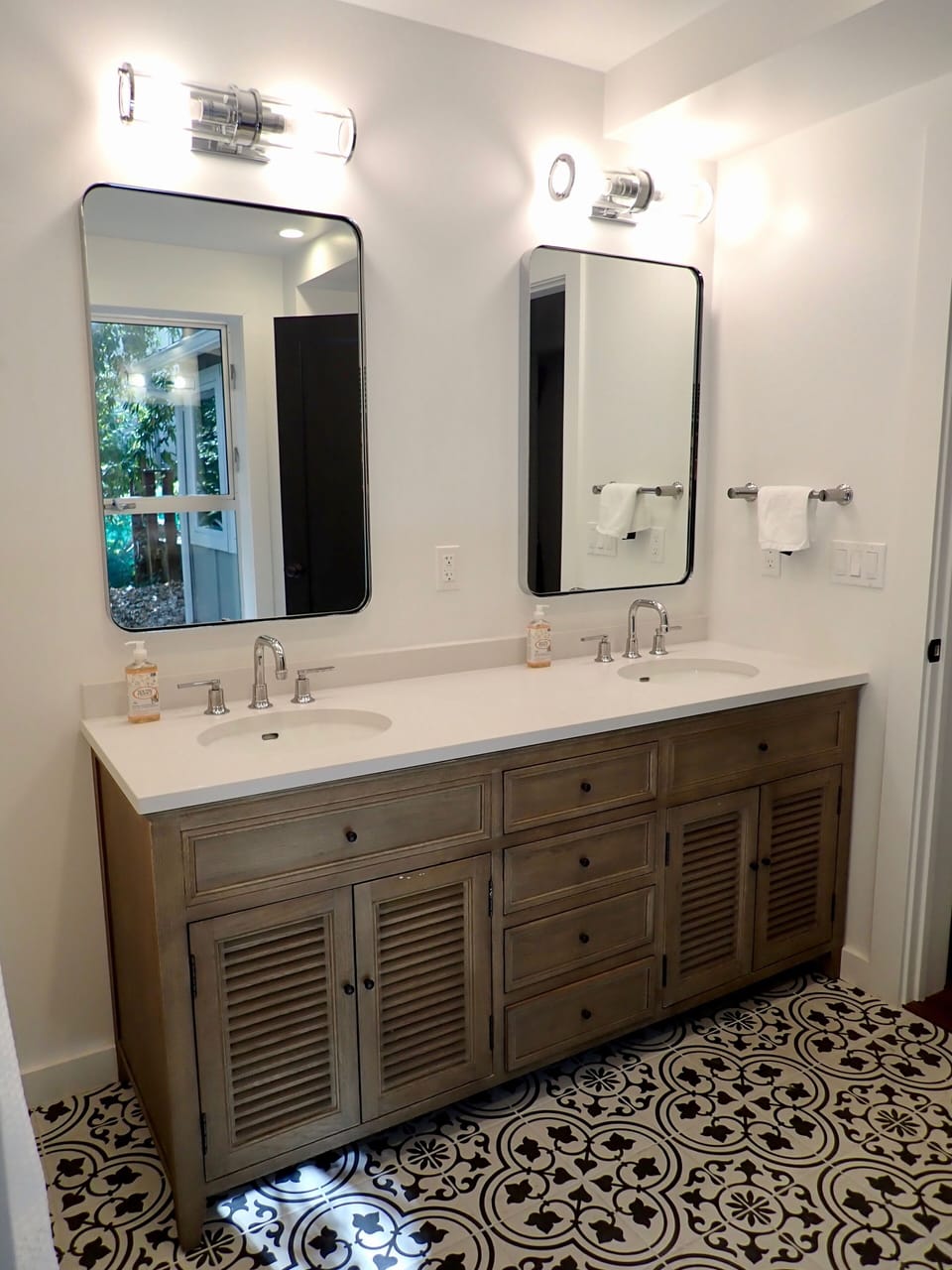 Large, luxurious bathroom with Restoration Hardware double vanity