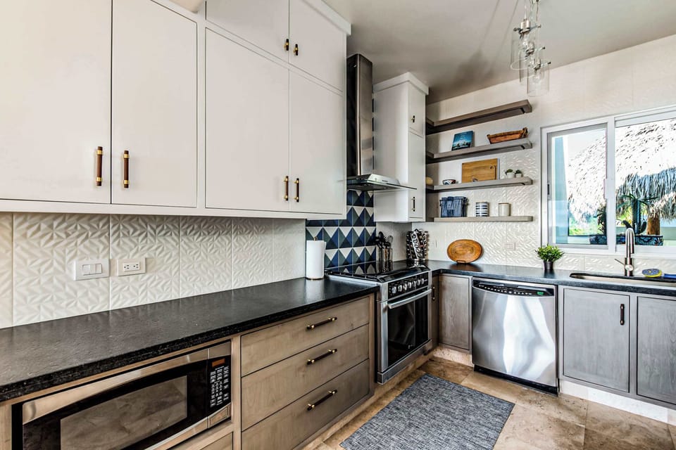 Kitchen fully equipped: microwave, oven, and coffee maker.