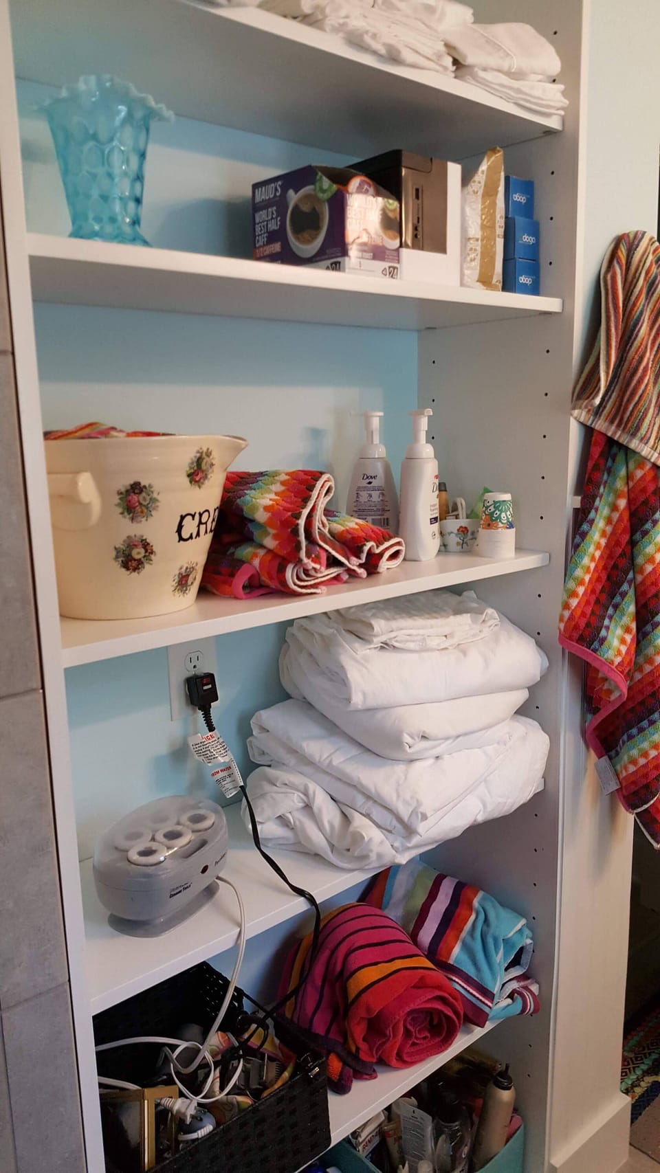  storage of extra linens,  toiletries and hair dryer