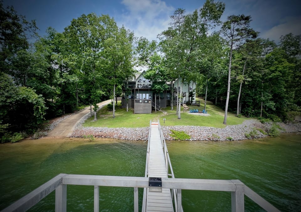 Nestled among mature trees, Decked Out offers privacy, shade, & lakefront living