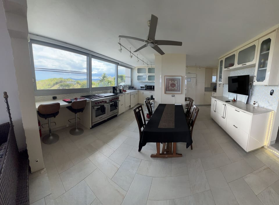 Gourmet kitchen with Amazing wall to wall views of the Caribbean Sea!