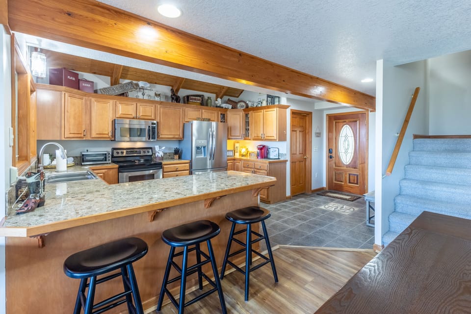 spacious fully stocked kitchen 
