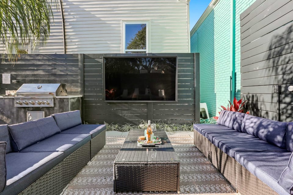 The outdoor living room has seating for 10 and features a huge 75" HDTV.