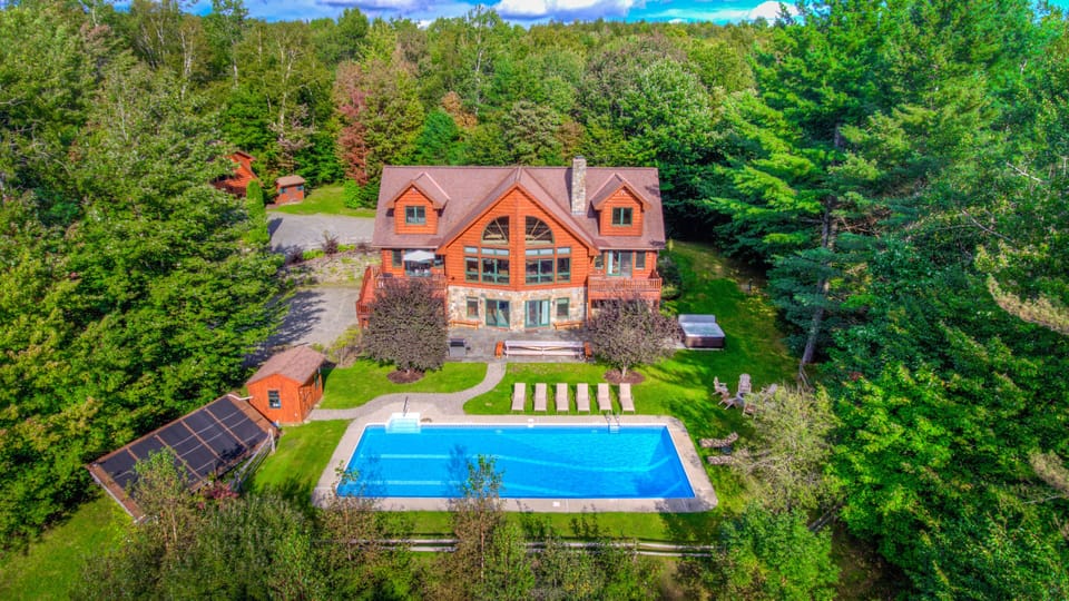 The home from above in summer.