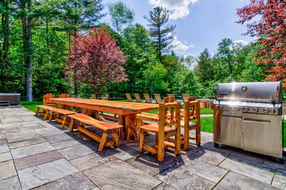 Another look at the huge outdoor table! Live edge, custom benches and chairs.