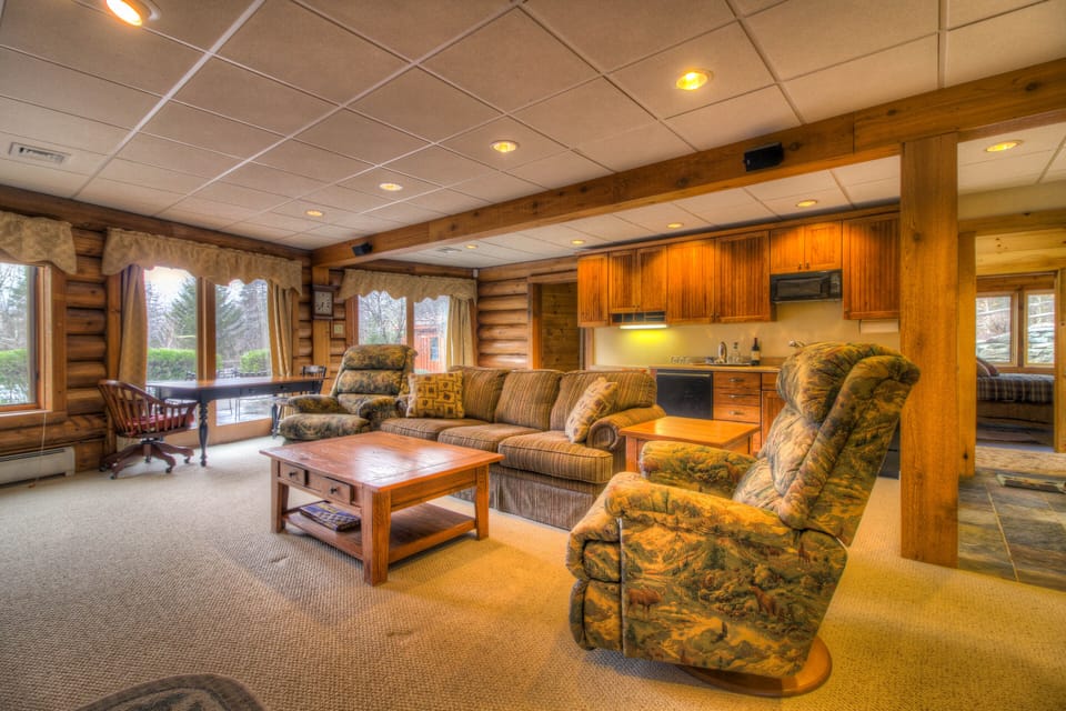 Main house lower level family room has lots of seating.
