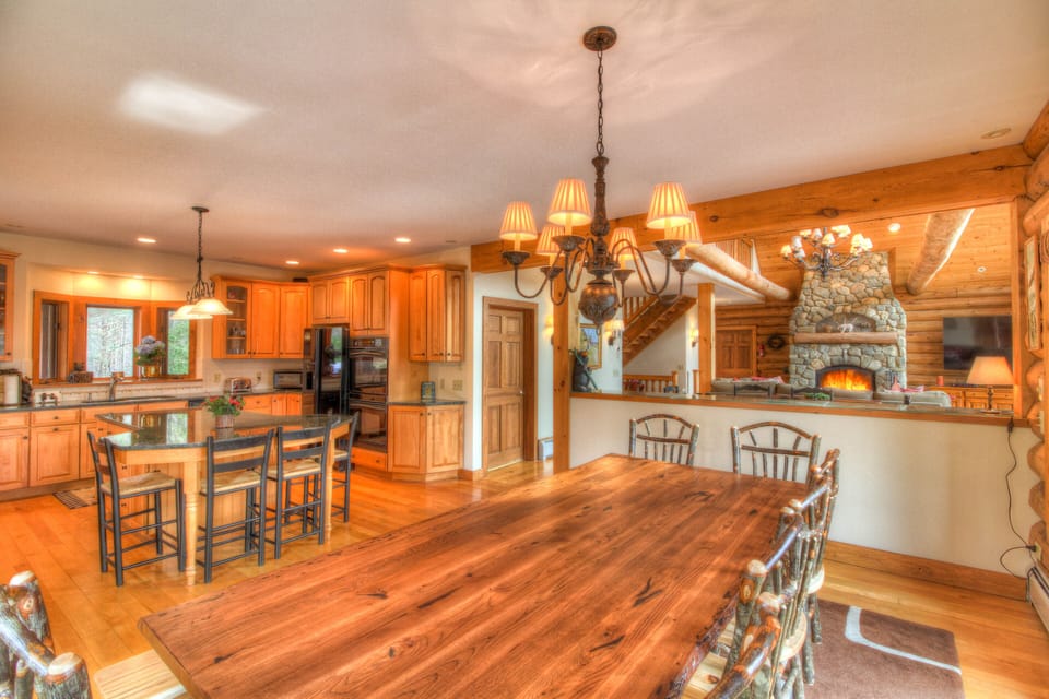 A view of the dining room, kitchen, and family room.