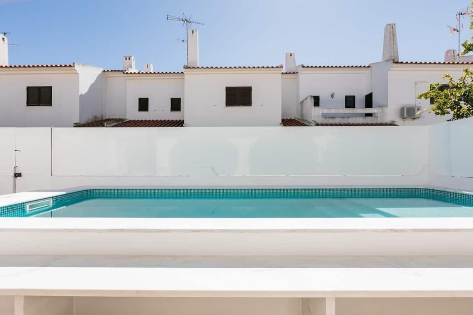 Outside space with dinning area, pool, BBQ and sun lounges