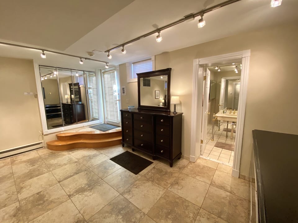 Dresser and entrance to downstairs bathroom